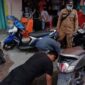Terlihat Sejumlah Warga yang Melakukan Push Up Karena Kedapatan Tidak Memakai Masker. FOTO : BPBD Tanjabbar