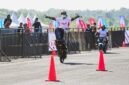 Seorang stunt rider menunjukkan kemampuan terbaiknya melalui aksi freestyle ekstrem pada pembukaan ajang Pertamax Turbo Drag Fest 2026 Putaran I di Lanud Gading, Wonosari, Yogyakarta.  (FOTO : Dok. Pertamina)