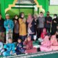 Hj. Erliani Berikan Saat Serahkan Bantuan Sajadah dan Al Quran ke Ponpes Husnul Khatimah Tungkal II Sabtu (18/12/21). FOTO : Dok. TIDAR TJB