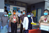 FOTO : Kegiatan Saka Bakti Husada Cabang Tanjung Jabung Barat, Ikatan Apoteker Indonesia (IPI) Dinas Kesehatan Saat Melaksanakan Kegiatan Pembangian Vitamin C Gratis, Kamis (26/03/20).