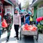 FOTO : Kegiatan Pembagian Paket Sembako oleh Polres Tanjab Barat, Kodim 0419 dan Yayasan Budhi Luhur, Senin (13/03/20)