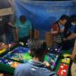 FOTO : Tim Satgas Tindak Operasi Pekat I Siginjai 2021 Polres Tanjab Barat Saat Mengerbek sebuah warung yang diduga dijadikan tempat judi tembak ikan di Desa Sungai Panoban, Kecamatan Batang Asam, Jum'at (16/04/21).