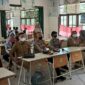 Pelaksanaan Vaksinasi oleh Polres Muaro Jambi dan Polsek Jajaran di SDN 205/IX Sengeti. FOTO : HUMAS PMJ