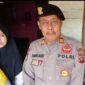 Kasi Humas Polres Muaro Jambi AKP Amradi, SE Ketika Serahkan Bansos Jumat Berkah ke Warga RT 14 Desa Bukit Baling. FOTO : HMS PMJ