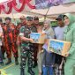 Dandim 0419/Tanjab Letkol Arm Dwi Sutaryo Bersama Ketua Persit Cabang XXVI Ny Tanty Dwi Sutaryo Bagikan Bantuan Sosial (ist)