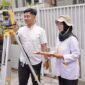 Petugas ATR/BPN Saat Melakukan Pengukuran Bidang Tanah (ATR/BPN)