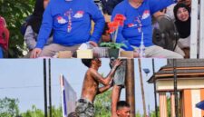 Bupati Tanjab Barat Anwar Sadat Didampingi Wakil Bupati Katamso Saat Menhadiri Panjat Batang Pinang (hms)