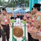 Pukul Gong, Ketua Majelis Pembina Saka Bhakti Husada Tanjung Jabung Barat H Zaharudin, S. KM membuka secara langsung Perticab SBH 2022, Jum'at (11/11/22) FOTO : Ist
