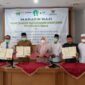 Penandatanganan kesepakatan bersama dan perjanjian antara Pemkab Muaro Jambi, Bank Cabang Sengeti dan Badan Amil Zakat Nasional Kabupaten Muaro Jambi oleh Bupati Muaro Jambi Hj. Masnah Busro, Senin (28/3/22). FOTO : Noval