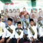 Bupati Muaro Jambi Hj. Masnah Busro Saat Hadiri Wisuda hafiz dan hafizah Rumah Tahfiz Al-Quran (RTQ)  Al Falah di Desa Talang Belido, Kecamatan Sungai Gelam, Kamis (3/2/22). FOTO : IG @Masnah