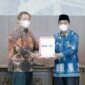 Ketua BPKP Provinsi Jambi dan Bupati Tanjab Barat Penyerahan LHP atas LKPD Tanjab Barat tahun anggaran 2021, Jum'at (20/5/22). FOTO : Ist.