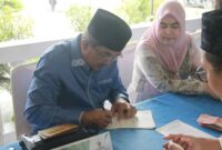 Bupati Tanjung Jabung Barat Pimpin Penyerahan Zakat Pejabat Eselon di Rumah Dinas. FOTO : IST