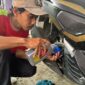 Pertamina Bantu Ganti Oli Gratis 1.000 Motor Terdampak Banjir Jabodetabek. FOTO : HMS