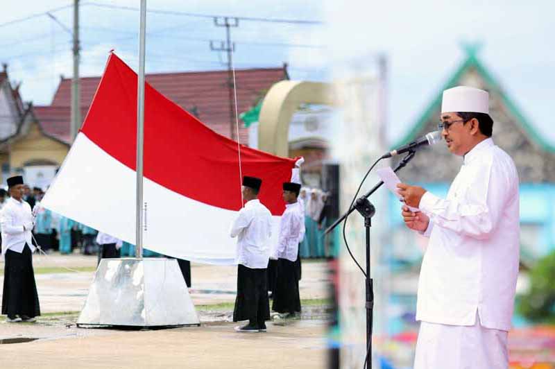 Bupati H. Anwar Sadat pimpin upacara Hari Santri Nasional Tahun 2022 di Alun - Alun Kota Kuala Tungkal, Sabtu (22/10/22). FOTO : Prokopim/Edt
